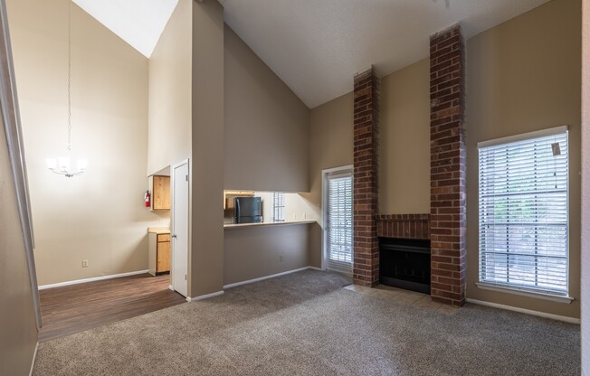 A living room with a fireplace and a television.