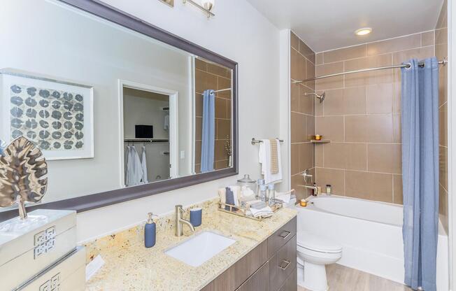 a double sink and large mirror