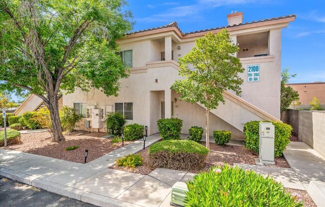 Charming 2-Bedroom First Floor Featuring Open Layout, Fireplace, Patio & Community Pool