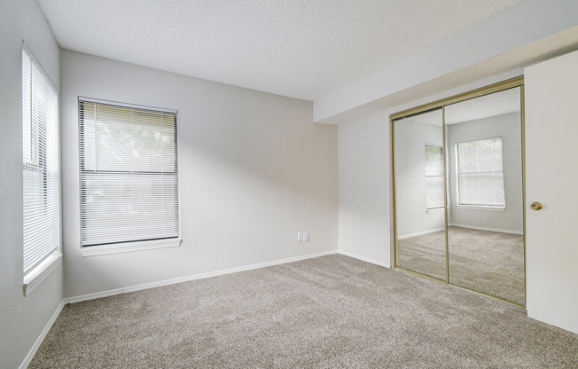 Oversized closet and fresh carpeting in bedroom at Rainbow Ridge Apartments in Kansas City, Kansas