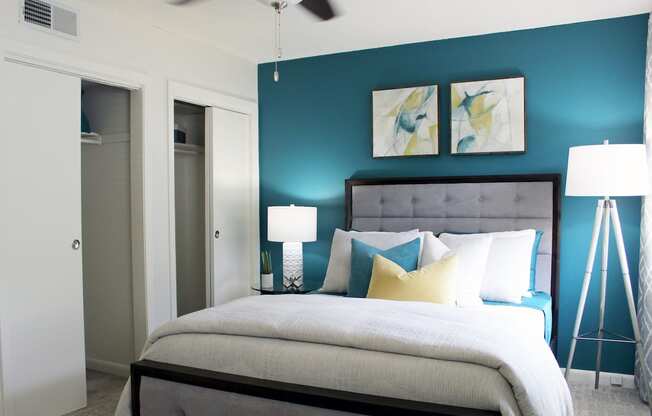 bedroom with double closet, fan, and plush carpeting  at Huntsville Landing Apartments, Alabama, 35806