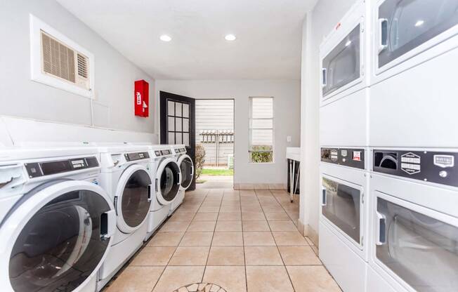 Laundry room at Royal Wildewood Manor Apartments, Clute, TX