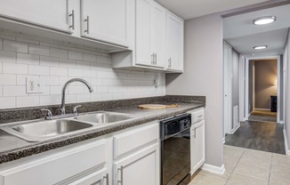 Westchase Apartments in Harvey LA photo of a kitchen with white cabinets and a sink
