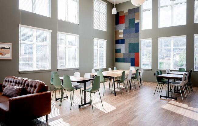 a living room with a couch and chairs and a rug