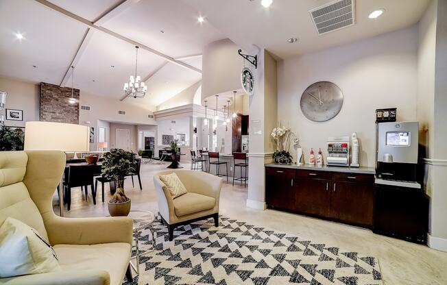 a lobby with couches and chairs and a coffee bar