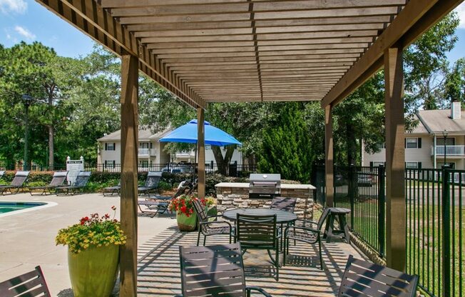 Outdoor Grill With Intimate Seating Area at Inverness Lakes Apartments, Mobile