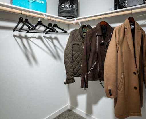 A Jonatman clothing store with a coat hanging on the wall.