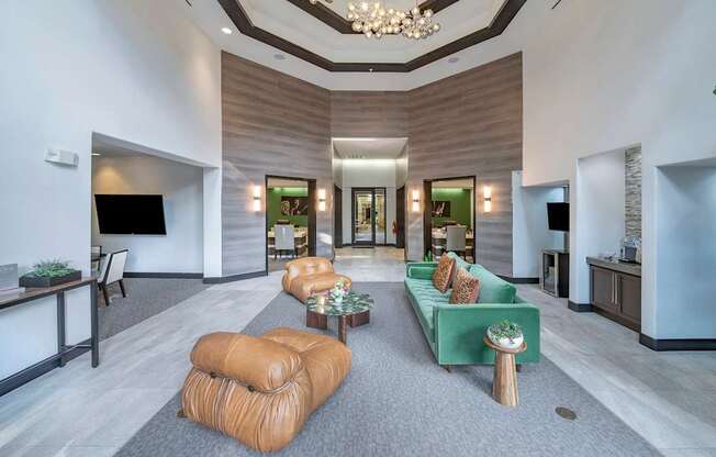 the lobby of a hotel with couches and a reception desk at The Hendrix, Atlanta, GA