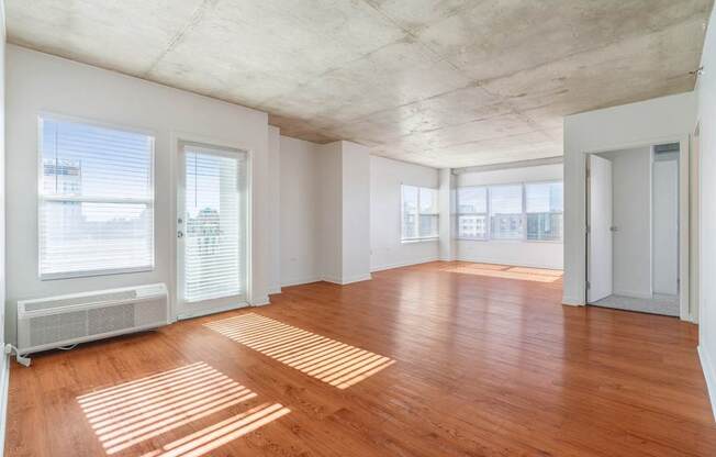 A room with wooden floors and white walls.