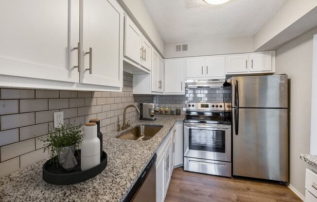 Fully Equipped Kitchen Includes Frost-Free Refrigerator, Electric Range, & Dishwasher at The Waverly, Belleville, MI