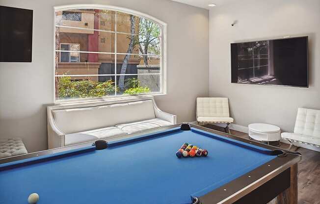 Community Clubhouse Pool Table at Reserve at Rancho Belago Apartments in Moreno Valley, CA.