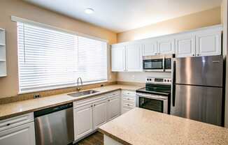 Full Gourmet Kitchen with Stainless Steel Microwave & Dishwasher at 97124 Apartment