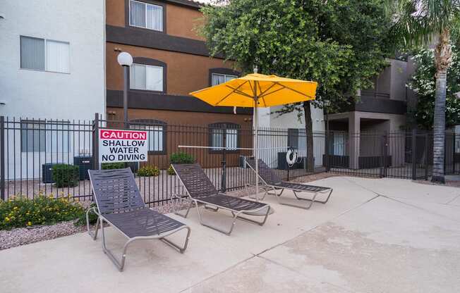 A pool area with a sign at Sterling Point Apartment Homes, Phoenix, Arizona