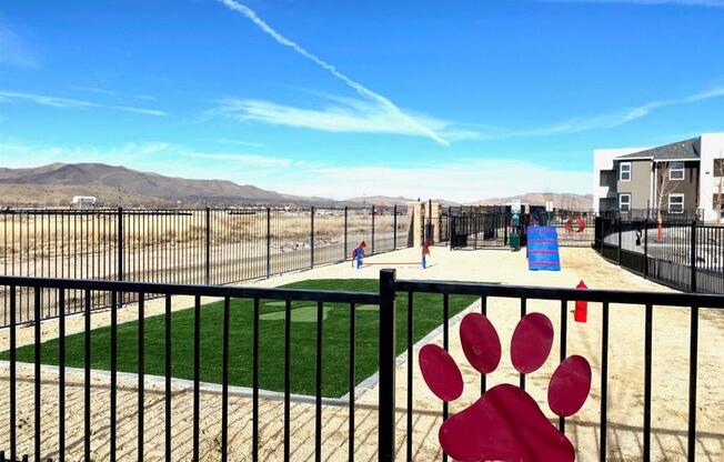 fenced dog park with grassy area