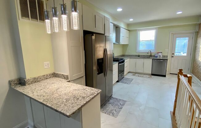 Beautiful 3 Bedroom Renovation in Greektown with Parking Pad