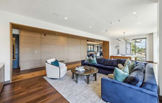 Living room with pool table at Bayview Apartments, California