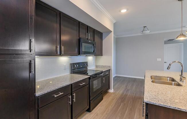 a large kitchen with stainless steel appliances