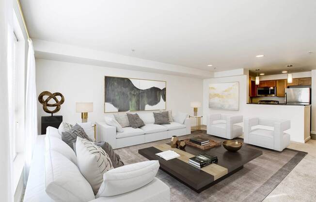 a living room with white couches and a coffee table  at Delano, Redmond, 98052