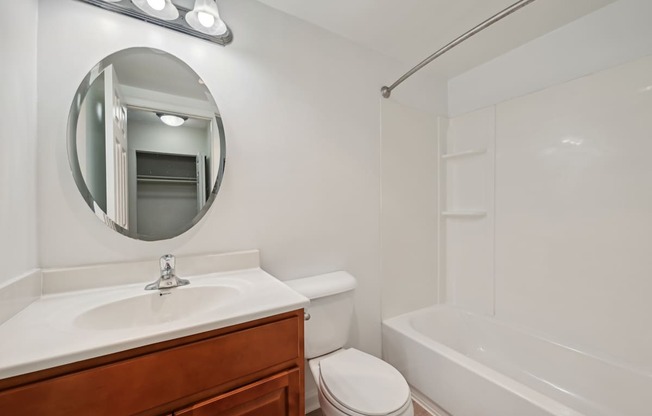 a bathroom with a sink toilet and a bath tub at ReNew Odenton