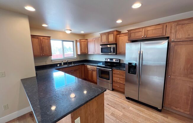 3-Bedroom Townhome with Double Garage & Private Fenced Yard