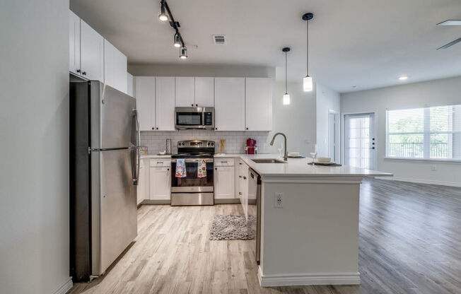 the preserve at ballantyne commons apartment kitchen with stainless steel appliances