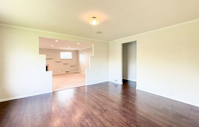 Beautiful recently remodeled 4 bed 2 bath home. Perfect for multi generational living with second kitchen in basement!