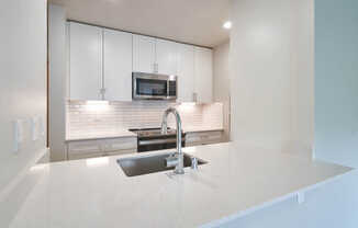 Kitchen with Breakfast Bar and Stainless Steel Appliances