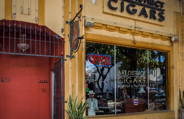 A cigar shop, located conveniently near InTown Apartments.