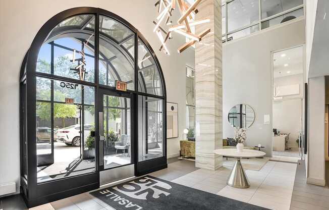 A black and white entrance mat with the word "ENTRANCE" on it.