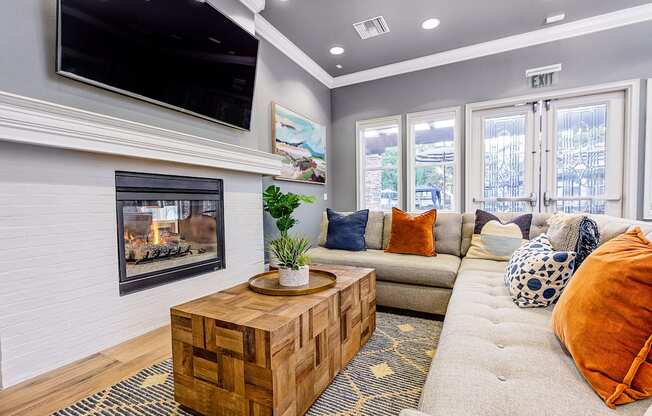 Clubroom with seating and TV at Barrington Place, Rancho Cucamonga, California