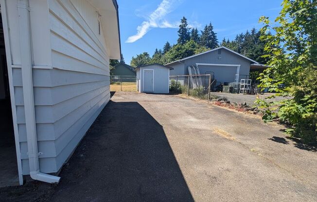 Rambler with large yard and storage shed...