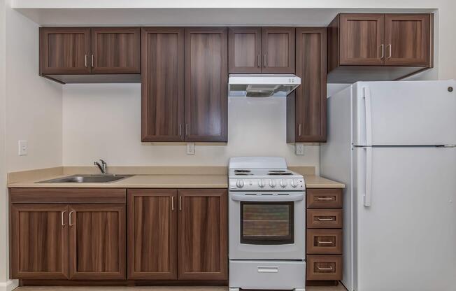 a kitchen with a stove top oven sitting inside of a refrigerator