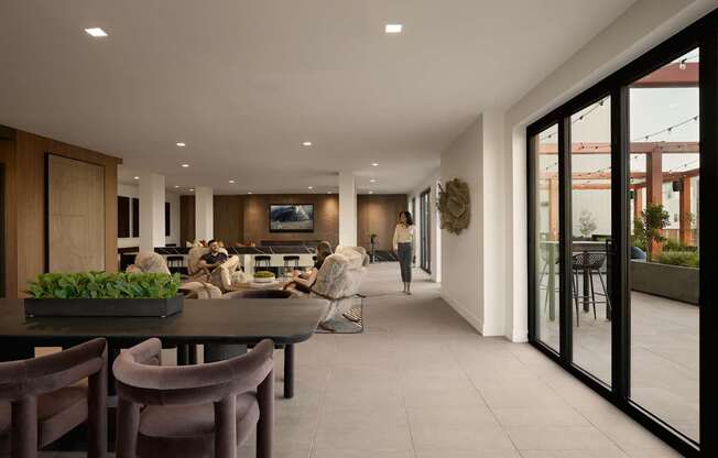 A modern dining room with a table set for four.