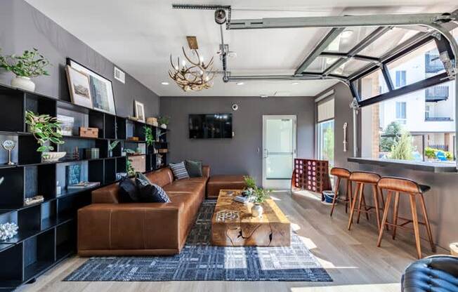 a living room with a brown couch and a coffee table