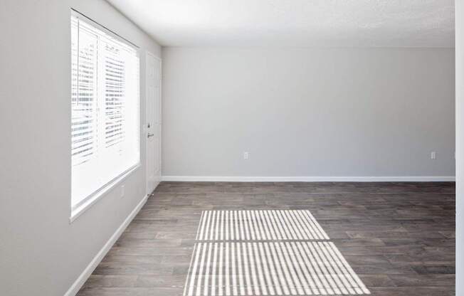 A room with a striped rug on the floor.
