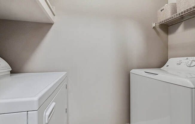 Model Laundry Room with Washer & Dryer at Park West Apartments located in Houston, TX.
