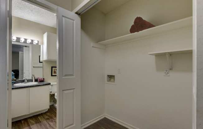 a kitchen with a sink and a mirror in a 555 waverly unit