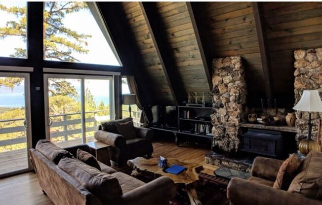"Million Dollar Views" This home offers breath-taking views of majestic Lake Tahoe, a spacious home perched on the mountain side surrounded by large enchanted Pines; this is the home for you!