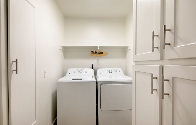 A laundry room with a washer and dryer.