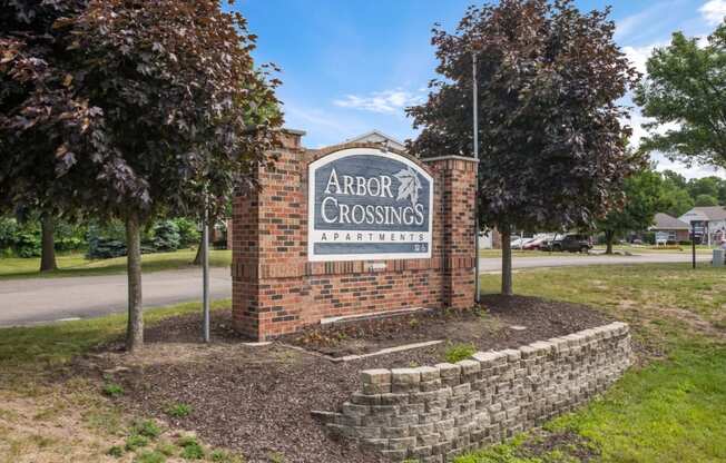 the sign for arbor crossings on the side of a road