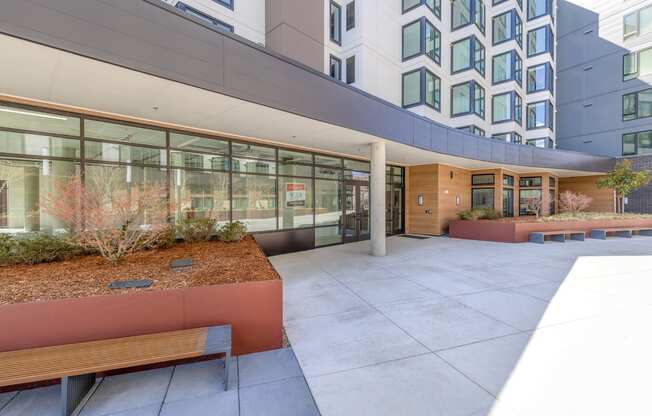a courtyard with benches and a building in the background at Marina Square, Bremerton, WA