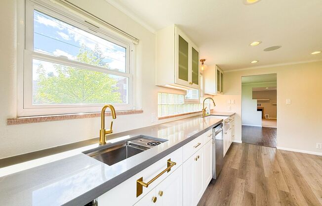 Beautiful recently remodeled 4 bed 2 bath home. Perfect for multi generational living with second kitchen in basement!