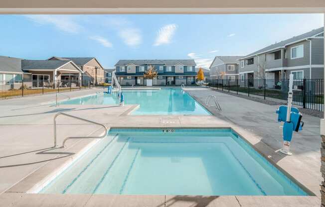 the preserve at ballantyne commons pool with apartment buildings