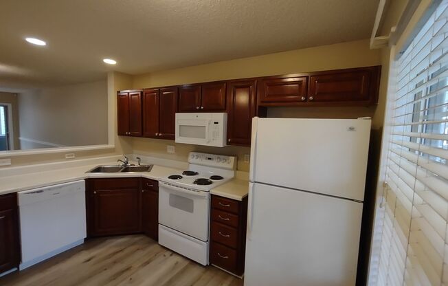 Pristine, move in ready Townhome located in the Holly Ridge Complex!