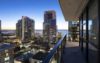 a balcony with a view of San Diego at night