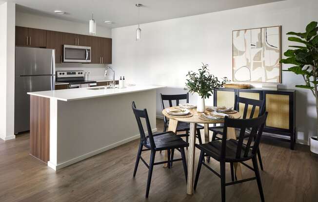 a kitchen and dining area in a 555 waverly unit