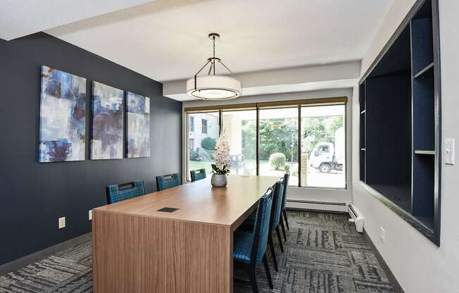 The Edge of Uptown Apartments | Conference Room with Large Table and 6 Chairs