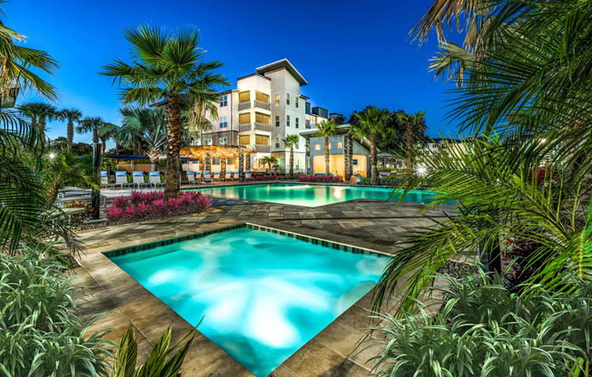 Large swimming pool with palm trees at Pearce at Pavilion Luxury Apartments, Riverview, 33578
