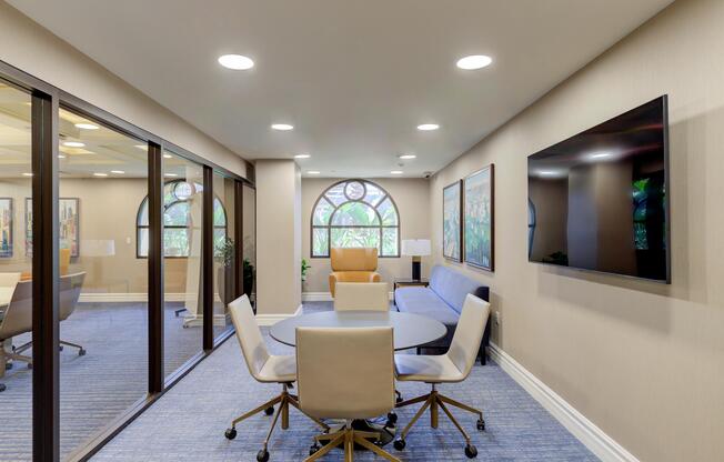 a room filled with furniture and a large window