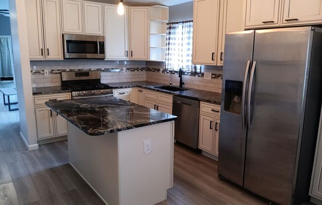 Cozy 4 bedroom, 2.5 bathroom home! Showings coming soon! Price Drop!!